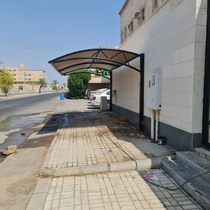 مظلات مواقف سيارات قماش متعددة المركبات.